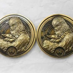 Peter Mayhew Instagram - LINK IN BIO!  Whoa!  This year’s Star Wars charity challenge coin is the first time we’ve done this 3D effect - Chewbacca and Grogu really pop!  Beautiful artwork by Richard Gonzalez - if you order $100 in challenge coins at the link above one coin will be replaced with this antique bronze colorless variant that is strictly limited to 200 variants.  We’ve made about a dozen coins since 2011 and this might be our favorite! 🚀

Coins start shipping June 15th!  Baby Yoda!
Help The Wookiee Give!