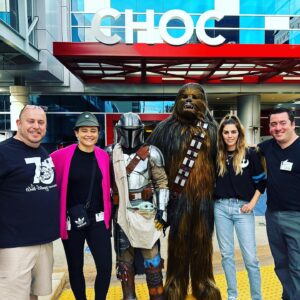 Peter Mayhew Instagram - We are so thankful for these amazing people!  Last Thursday our team departed San Antonio, Texas with a sixteen foot box truck filled with Star Wars toys.  We partnered with @official501st to drop these toys at Children’s Hospitals in Dallas, Albuquerque, Tucson, Phoenix, and ended at @chocchildrens in Orange, CA where we were joined by thekatyo from The Mandalorian and Aayla Secura herself: @amyallen_jedi.  All made possible because of the continued toy donations from @HolocronToyStore.  Thank you!