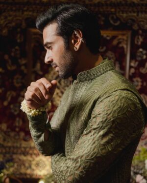Pulkit Samrat Instagram - My journey to the altar was nothing short of a fairy tale, ignited by a single phone call to my dear friend @theanisha , which was filled with screams of excitement over the news of my upcoming wedding. Despite the absence of a set venue or date, I was unequivocally certain about one thing: my attire would be crafted by the incomparable Anamika Khanna. Our adventure began in the opulent @anamikakhanna.in Mumbai store, amidst the men’s section, but it was in the women’s section where we found our muse—a stunning piece of embroidery that captured my heart and set the theme for my wedding ensemble.

Anamika wasn’t the only magician behind my wedding wardrobe. For the Mehendi ceremony, @farazmanan was the clear choice. Despite his hectic schedule and the collection still being under development, Faraz crafted a breathtaking olive green outfit for me, allowing me to be the first to showcase his new collection. His dedication was a gift I couldn’t have been more grateful for.

As the wedding approached, the need for a Cocktail/Sangeet outfit became urgent. With just a week to spare, we were struggling to find someone who could encapsulate the essence of “shimmer” I desired. It was then that I was introduced to @rahulmishra_7 , and through the efforts of the wonderful Divya, I was adorned in an outfit that radiated shimmer and elegance, surpassing all expectations.

The Black Tie event demanded nothing less than perfection. Rohit Gandhi & Rahul Khanna were the craftsmen of choice for my tuxedo, presenting me with an array of swatches and patterns, making the selection process delightfully challenging. Surrendering to their expertise, the final piece was nothing short of spectacular, becoming one of my favorite looks. @rohitgandhirahulkhanna 

Anamika Khanna didn’t just stop with the wedding outfit; she designed my haldi and both my grah pravesh outfits, sealing my admiration for her forever.

Reflecting on my wedding journey, I’m overwhelmed with gratitude for these fashion pioneers who turned my dreams into reality. Their passion, creativity, and dedication made me the happiest groom alive. My heart is full, and wardrobe, a testament to their genius. 💓🕺