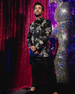 Pulkit Samrat Instagram - My journey to the altar was nothing short of a fairy tale, ignited by a single phone call to my dear friend @theanisha , which was filled with screams of excitement over the news of my upcoming wedding. Despite the absence of a set venue or date, I was unequivocally certain about one thing: my attire would be crafted by the incomparable Anamika Khanna. Our adventure began in the opulent @anamikakhanna.in Mumbai store, amidst the men’s section, but it was in the women’s section where we found our muse—a stunning piece of embroidery that captured my heart and set the theme for my wedding ensemble.

Anamika wasn’t the only magician behind my wedding wardrobe. For the Mehendi ceremony, @farazmanan was the clear choice. Despite his hectic schedule and the collection still being under development, Faraz crafted a breathtaking olive green outfit for me, allowing me to be the first to showcase his new collection. His dedication was a gift I couldn’t have been more grateful for.

As the wedding approached, the need for a Cocktail/Sangeet outfit became urgent. With just a week to spare, we were struggling to find someone who could encapsulate the essence of “shimmer” I desired. It was then that I was introduced to @rahulmishra_7 , and through the efforts of the wonderful Divya, I was adorned in an outfit that radiated shimmer and elegance, surpassing all expectations.

The Black Tie event demanded nothing less than perfection. Rohit Gandhi & Rahul Khanna were the craftsmen of choice for my tuxedo, presenting me with an array of swatches and patterns, making the selection process delightfully challenging. Surrendering to their expertise, the final piece was nothing short of spectacular, becoming one of my favorite looks. @rohitgandhirahulkhanna 

Anamika Khanna didn’t just stop with the wedding outfit; she designed my haldi and both my grah pravesh outfits, sealing my admiration for her forever.

Reflecting on my wedding journey, I’m overwhelmed with gratitude for these fashion pioneers who turned my dreams into reality. Their passion, creativity, and dedication made me the happiest groom alive. My heart is full, and wardrobe, a testament to their genius. 💓🕺