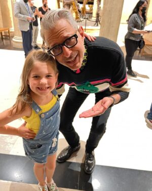 Pyper Braun Instagram - I am so behind on posting! We were super pumped to work with and meet this icon! Unfortunately the episode did not air, which is just a part of this industry. Pyper had so much fun chatting with @jeffgoldblum , and he even took a moment to snap a photo.
We got to film at the @nhmla , meet a paleontologist , and see real fossils!
We will definitely be back to the museum!
She was also very excited to see her buddy @carter.chee  and work with him again!
•
#seeyalaterostrich #blessed #grateful #setlife #workingkid #dinosours #jurrassicpark #jurrassicworld