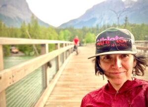 Quinn Brett Instagram - Simplicity. Being disabled is anything but simple.  The Tour Divide hand-cycle and truly most my adventures prior to my injury, to some could be perceived as “wild” endeavors. To me they are a scrutinized spreadsheet or list that makes the adventure seem contained and manageable.  Reasonable mitigation for the inevitable stress that would flood in when the actual shit hit the fan. #somuchfuckingplanning 
.
.
.
Such is disabled life. Everyday. Every minute for some (sometimes me with nerve pain) is learning to reasonably mitigate the stress of pain, cultural stigma, shame and value. Oh and all the extra planning and effort because shit is not #accessible. 🤯
.
.
.
The same thing that brought me into the #spinalcordinjury club is the same thing that clears my head and gives me peace. #timeinthewoods #withlikemindedpeople 
.
.
.
While in the woods with good company churning my arms over and over across beautiful country—- Today my thoughts drifted to the simple pleasures —things I loved like Broccoli and mangos. Oh and the what shall next adventure be?? 🤗 @hi5sfoundation #tourdivide @adidasterrex #impossibleisnothing 
.
.
.
.
. 
<photo-closer up of a brunette woman wearing a baseball hat. Mountains in the background and the wind is blowing.>
.
.
 .
#climbing #rockclimbing #enduranceathlete #skiing #mountains #mountainbiking #trailrunning #running #roadbiking #crossfit #yoga #paragliding #outdoors #athlete #spinalcordresearch #paralyzed #medicine  #protectpubliclands #nationalparks #summitsforall #wilderness #disability