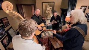 Ricky Skaggs Instagram - #MusicMonday Ricky Skaggs & Kentucky Thunder get ready in their dressing room backstage for their Feb. 3 performance on the newly renovated @opry stage, while Bill Monroe’s photo looks down upon them in the background. Then Ricky Skaggs opens the show as he and the whole cast sing, “Will the Circle be Unbroken.”

📷: @81crowe (1 & 2)
📷: @jacydawnvaleras (3)
.
.
.
#opry #grandoleopry #stage #countrymusic #bluegrass #rickyskaggs