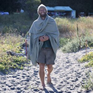 Rob Greenfield Instagram - This is my entire wardrobe.

18 items – 4 shirts, 2 shorts, 1 pants, long underwear top and bottom, shawl, hat, cowl, wool booties, moccasins, 3 pairs of socks and a bag.

All hand made. All natural fiber. All naturally dyed.

Just as a deer could fall to the forest floor and return to the soil, so could I in these natural clothes. 

Wool, linen, cotton, deer leather and sinew and wood are the materials.
Black walnut, indigo, weld, turmeric and iron rust are the dyes.

It’s been a year since the first item was completed and 3 months since I shedded my last clothing from my former life.

I can’t say it’s all been easy. Both shorts have ripped in the butt area and the soles of the shoes have already worn through. Many of the clothes were made too small and seams are breaking where they are too tight. They aren’t the most comfortable clothes I’ve ever worn… But this is all part of the experiment in reconnecting with Earth. I am elated for the trials and tribulations of it all. To live in harmony with Earth is to repair, to rethink and to reconstruct my possessions, my mind and all of my relations.

My wardrobe is not fully complete, and I am calling out to the community for a few items!

To keep my nose and head from burning I am seeking a sun hat. Felted wool or woven plants are my ideal materials, but I’m exploring the world of covering my head with the gifts of Earth!

For warmth, I am seeking a wool sweater. Is there anyone with a homemade, natural fiber and naturally dyed sweater I could buy or borrow until this fall? Or someone who could make one this month? I can source and provide the local yarn!

For soles for my shoes, I am seeking thick, naturally tanned leather as well as some sinew. I only need small chunks, so scraps could do. I’d also love to hear any experiences with long-lasting natural soles!

To make padding for my backpack straps, I need some wool roving.

I’m happy to purchase, trade, or receive as gifts for those who operate in a non-linear, more circular giving system like I do!

Love,
Robin

Photo by Greg Sachs @sachsquatchinthewild
Learn all about my journey to natural clothes at robingreenfield.org/clothes