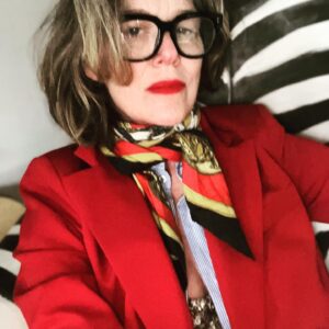 Rochelle Redfield Instagram - Friday night ‘fit after a looong week, like a ten day week. Dressing up for a Gorgeous bday celebration for a beautiful human. Thankful for my friends and community.  RED suit by @mango , (super on sale )  vintage scarf bought on an airfrance flight in the ‘80’s from #hermes , my dad’s vintage men’s dress shirt, (Thanks dad! ) Gold sequined wife-beater ( ahhh the irony!) from #zara  Hand painted #lauraashley zebra arm chair by moi. Red lip by #face {thanks #sophiaisdenim ) wrinkles by #life  None of this is sponsored, but #everyoneisdoingit .#thisis60 #menswear #suitsforever.  #imhappythisisjustmyrestingexhaustedface