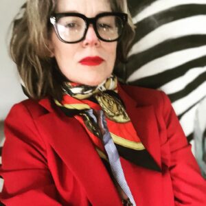 Rochelle Redfield Instagram - Friday night ‘fit after a looong week, like a ten day week. Dressing up for a Gorgeous bday celebration for a beautiful human. Thankful for my friends and community.  RED suit by @mango , (super on sale )  vintage scarf bought on an airfrance flight in the ‘80’s from #hermes , my dad’s vintage men’s dress shirt, (Thanks dad! ) Gold sequined wife-beater ( ahhh the irony!) from #zara  Hand painted #lauraashley zebra arm chair by moi. Red lip by #face {thanks #sophiaisdenim ) wrinkles by #life  None of this is sponsored, but #everyoneisdoingit .#thisis60 #menswear #suitsforever.  #imhappythisisjustmyrestingexhaustedface