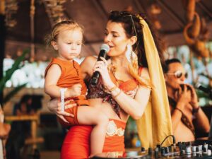 Ruby Chase O'Neil Instagram - Sweet moments from my daytime set on Lapa Stage☺️
Fun fact … 
Lapa means Macaw 🦜

This community oriented bird is monogamous and mates for life with the same partner.. they are romantic in nature and fly with their wing tips touching… aka flying holding hands 🥹 cute right? 

When @loverofthegarden and I were doing our research leading up to the set, we decided to make the theme of this particular daytime set a tribute to the birds, and our communal nature ✨

It was an epic moment of collaboration with  @loverofthegarden adding ceremonial vocals, @eagle_condor_synergy adding percussion and vocals, and Carlos @cardan_balam_musica weaving with many of his ceremonial Mayan instruments.. I actually met him the night before the set and invited him to come and play with us spontaneously. Neither one of us had heard each other’s music yet, but the creative vibes were there :) 

Azani also made a special appearance for a little b2b baby moment ;) he made me a very happy auntie to show him my point of view from the decks as we have had a lot of fun playing with music on my babysitting moments :) 

Thank you @visual_feeling for these sweet memories!! 📷🥰

Reppin my new gold scarf in the hair thanks @true_nature_attire 

#envisionfestival #envision #lapa
