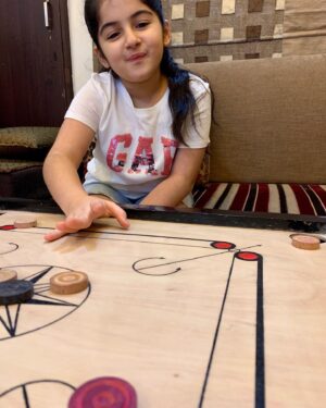 Saisha Bajaj Instagram - “ Play is our brains favourite way of learning “
#carrom #play #indoorgames 
#fun #stayinghome #learning #game