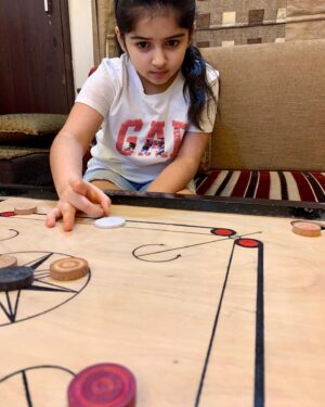 Saisha Bajaj Instagram - “ Play is our brains favourite way of learning “
#carrom #play #indoorgames 
#fun #stayinghome #learning #game