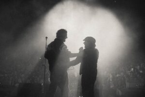 Sam Fender Instagram - The last few days have been insane. Sharing the stage with @brianjohnsontv was a dream come true. When we first started seeing success with our band, me and Dean used to watch interviews of Brian to keep ourselves grounded - he is the prime example of a Geordie who has never forgotten his roots. Not only that, I also brought out my first guitar teacher who showed the entirety of St James’ Park how it’s actually done. Phil Martin, I wouldn’t have been able to do any of this if it wasn’t for your tutelage and back when I had my first band (when we were bairns, 14 or 15) you let us rehearse in the Gasworks practice rooms for free. We need more people like you in our community 🤍🖤🤍🖤