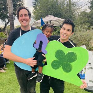 Sam Tsui Instagram - 🍀❤️lucky charms💫🎈
Excited to bring back the epic group costume with @caseybreves @yzinkow and @mollyshoffman84 now featuring our beautiful babies as the littlest charms!! It was an epic second Halloween for Elaia - this time she actually got to get out of the wagon and trick-or-treat a bit herself! So happy to get to share our tradition of ambitious, ungainly, and impractical cardboard Halloween costumes with our kids!! #halloween #halloweencostume #luckycharms #halloween2022