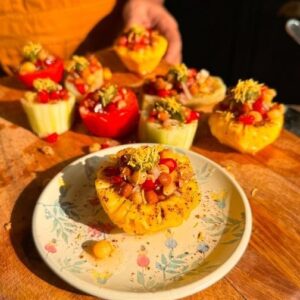 Saransh Goila Instagram - Made this iconic chaat recipe thoda hatke (Goila style) back in 2011 for chef @sanjeevkapoor and this legendary street food recipe helped me get notice on the Maha challenge (a show that I went on to win later) Years have gone by and I've not only had good luck and fortune of having met my idol but also the opportunity to be mentored by him, to be his family and also a friend! But no matter what every time I meet him I still feel like that 12 year old boy sitting in front of his telly wondering if someday I'll get to meet this incredible human. Much love for you Chef Sanjeev and I hope you have an incredible Birthday 🎈🎂 week. Happy wala Birthday in advance ❤️
.
.
Kuliya ki chaat 

Peel & Cut a cucumber, tomato, sweet potato & pineapple 
Scoop out the center as shown (you can use remains of veggies or fruits to make a veg stock or juice them)

For the filling 

1 cup Boiled Kala chana 
1/2 cup Boiled white matar 
2 tbsp Raw mango, chopped 
1/2 cup Onion, chopped 
1/2 cup Tomato, chopped 
1/4 cup Pomegranate seeds 
1 tsp Jeera powder 
1/2 tsp Kala namak 
1 tsp Kala chaat masala 
Salt to taste 
Juice of 1 lemon 
Mix everything well 

To the fruits 
1 tsp Imli chutney 
Top it off with the chana mix 
Green chutney 
Sev 
Sprinkle Kala chaat masala generously 
Squeeze some lemon juice 

Serve cold 
Delishaaas 😮‍💨🤌🏻🤤