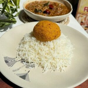 Saransh Goila Instagram - This has to be one of the most soul satisfying meals I've had. Kandi Pachadi (Andhra style roasted toor dal chutney) paired with Vankaya Pachi Pulusu (Eggplant Tamarind Chutney) and served with hot rice and ghee. Sometimes it's the simplest of meals that do the trick. You can prepare this within 15 mins and you'll say Delishaaas..I'm sure many homes make this differently, do share your versions with me and I'm happy to try in the coming week for lunches!
.
.
Kandi Pachadi 

1/2 cup Toor dal 
Dry roast till fragrant & golden 
2 tsp Oil 
2 tbsp Urad dal 
A few dried red chili 
A few Garlic cloves, peeled 
Sauté till fragrant & golden 

Add toor dal to the mixer 
Add chili, garlic & dal 
A small piece of Tamarind 
1/2 tsp Haldi powder 
Salt to taste 
Grind into a powder 
Add 2 tbsp Water 
Grind again 
Look at that 

For the tadka 

1 tbsp Oil 
1/2 tsp Mustard seeds 
A few curry leaves 
1/4 tsp Hing 
Add the tadka to the podi 
Mix well 

Serve with hot rice 
Delishaaas 😮‍💨🤤