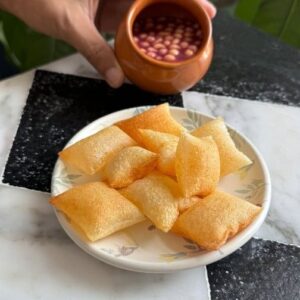 Saransh Goila Instagram - This Golgappa - Pani Puri - Puchka is made with Aloo! Yes you heard me right POTATO. Today is international day of 🥔 potato and we are presenting the French Pommes Soufflées made desi into a our beloved Pani Puri. You can try whatever Pani you like with it, I tried my favourite pomegranate Pani with it and it was just Delishaaas. After these puff up you can either second fry in extremely hot oil for them to crisp up or even air fryer works! Chalo time to say - Aloo You ♥️🥔
.
.
Anar aloo panipuri 

Sound on 🔉 

Peel 2 Chips wale aloo
Thinly slice the chips 
using a mandoline slicer 
Look at that 🤌🏻
(NEEDS TO BE SUPER THIN) 

Sprinkle potato starch generously on one slice 
Dust off the excess 
& stick the other side onto it 
Press it firm 
& cut into desired spheres 

Fry these carefully in moderately hot oil 
Till they puff up 
Drain them off 
& fry again in hot oil till GBC 😮‍💨🤌🏻

Or air fry at 180 for 7/8 mins 

For the Anar pani 

2 cups Anar, peeled 
Handful of fresh coriander & mint 
1/4 piece of Beetroot, peeled 
1 Green chili 
1/2 cup Raw mango
1/2 inch Ginger 
1 cup Water 
1/4 cup Castor sugar 
Blend it well 
Strain the paani 
Add ice cubes 
1/4 tsp Black salt 
1 tsp Bhuna jeera powder 
1 tsp Chaat masala powder 
1/2 tsp Black pepper powder 
Salt to taste 
& mix everything well 
Add some boondi 

Crack the puris open 
Stuff with aloo masala 
Pour the paani 

Delishaaas 🤌🏻🔥