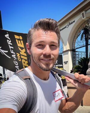 Scott Clifton Instagram - On a technicality, daytime dramas aren’t affected by the SAG/AFTRA strike, as they fall under a different kind of contract. So I’m counting my blessings to be able to work at a time when so many of our fellow actors are out here every day, sacrificing all comfort (both financial and physical) and taking an absolute beating from the July sun to ensure a better, fairer future for the performers—and writers—who make the films and shows we love possible. It was a joy to tag along today. 

Shoutout to @alisonhaislip for showing me how to picket like a pro. #sagaftrastrong