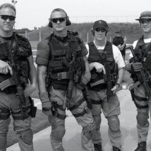 Sean Larkin Instagram - Early 2000s SWAT team training day.  For some reason a couple of the guys look like they belong in the Navy SEALs but I on the other hand look like a guy that won a work raffle to come play dress up with the SWAT team for a day.  In all honestly, my time on the team was incredible.  Experienced some crazy sh$t and made life long friendships.  #tulsa #police #swat