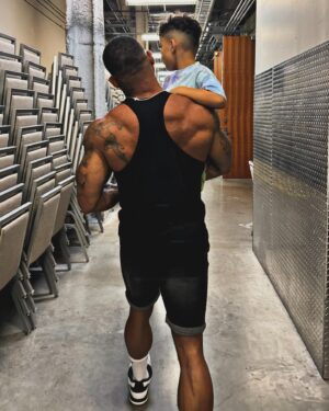 Shaun T Instagram - I tell my kids every single day, “You never have to ask to sit on my lap no matter how old you get and if you ask me to carry you I will say yes for as long as I can.” People make a point to tell me how fast time flies when you have kids and I always laugh because I’m like I KNOW. I make a point to connect with every moment I can and I LIVE IN IT. I look them in their eyes every moment they talk to me! 🥹😍😘 #dadlife #dadson 
Photo cred 📸 @chiphh