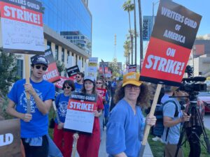Siân Heder Instagram - We’re on strike. Writers are the driving force behind film and television. We are responsible for creating, writing and producing more than 4,000 episodes of scripted programming and hundreds of films each year. We are asking for less than 2% of the Hollywood profits these massive corporations make off our work. And yes that means I’m picketing in a boot with a broken foot. #wgastrong