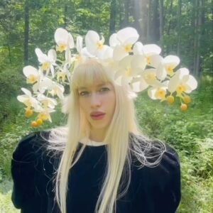 Sideara St. Claire Instagram - The orchid hat, designed for @worldofmyownnyc’s Metamorphosis runway show ⭐️🦢 This hat turned out better than I could’ve imagined and is one of my favorites, it felt illegal wearing this in the forest and teasing all the bees