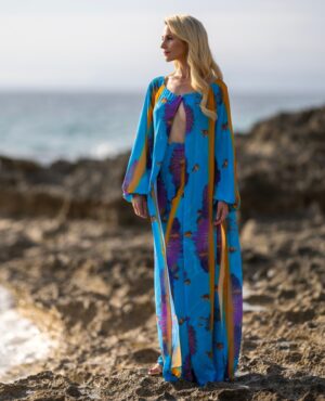 Silvia Schneider Instagram - Enjoy the sunset with our "Triton Cape & Trouser" ensemble. It´s one of many collection highlights and embraces summer at it´s best. The soft material feels like being kissed by the ocean. Find out more about the Modern Mermaid Collection. Link in bio...⁠
⁠
⁠
#summertime #summer #mood #happiness #chill