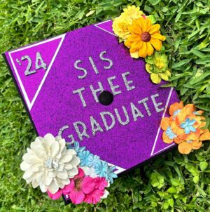 Sis Instagram - just tryna take in every moment of this nine year journey…..two days folks!!! graduation cap inspired by @raquel_willis  book (the risk it takes to blooom), hannah montana, reflection, renaissance, lilo and stitch, shsu, trans flag 🏳️‍⚧️, and barney thee dinosaur