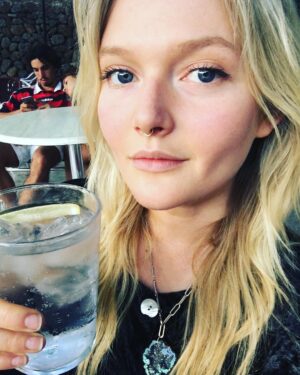 Sophie Kennedy Clark Instagram - Happy holidays folks from me and the bored as fuck couple behind me! #drinkinginDeia #photobombsarethebomb #vodkasophies