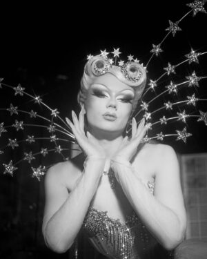 Starlet Instagram - Ru Are You💙💫

For Ru Are You I definitely wanted to go heavy on the old Hollywood glam, as it’s an era my drag is very deeply rooted in but I also wanted to reference things symbolic to me like stars and the colour blue. I drew inspiration from old glamour showgirls and actresses like Lana Turner in Ziegfeld Follies and my favourite film Cinderella. I couldn’t be happier with how this look came out💙✨💫

Hair: @carlbrownhair stoned by me✨
Corset: @misty_couture stoned and embellished by me✨
Wings and Wand by me✨
Photo: @jamie_noise 

With special thanks to @siblingstudios_ and to @fensuss for helping out on set💕
