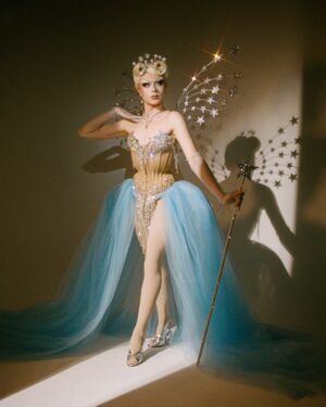 Starlet Instagram - Ru Are You💙💫

For Ru Are You I definitely wanted to go heavy on the old Hollywood glam, as it’s an era my drag is very deeply rooted in but I also wanted to reference things symbolic to me like stars and the colour blue. I drew inspiration from old glamour showgirls and actresses like Lana Turner in Ziegfeld Follies and my favourite film Cinderella. I couldn’t be happier with how this look came out💙✨💫

Hair: @carlbrownhair stoned by me✨
Corset: @misty_couture stoned and embellished by me✨
Wings and Wand by me✨
Photo: @jamie_noise 

With special thanks to @siblingstudios_ and to @fensuss for helping out on set💕