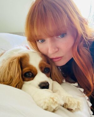 Stef Dawson Instagram - There’s a very good girl 🤍🐶🤍 Apparently it’s international dog day, but I think every day is a celebration of these little furry angels, sent from above to make our lives better! Especially in the hardest times. Missing my beautiful little Millie girl. The one with me in it was when I was packing, she knew I was leaving. The cat is Geoffrey, her bff🤍🐶🤍 #internationaldogday #millie #kingcharlescavalier