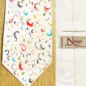 Stephen Fry Instagram - The days are getting shorter and the lockdown looser now and so I am bidding farewell to #fryties with this last display of 3 from my favourite tie-makers. They are each small, independent, imaginative and talented. We start with Nino’s, of Soho’s Brewer Street. The son of a well-known London tailor, Franco Santoro, Nino has been making bespoke shirts and suits since 1993. This gorgeous tie is hand painted. I have a black and white version too.

Pic 2 (swipe left) is from Penrose, who’ve been specialising in designing and making ties for years. This beauty reminds me of something sumptuously medieval – perhaps filtered through the mind of a Victorian like William Morris or Augustus Pugin.

Pic 3 is the work of Magties, who made ties for me in the latter series of QI. Alan Brooker started the company in Brick Lane and says in his little biog on the Etsy page where he still sells his remarkable creations: “I built a client range including Sir Paul McCartney, Stephen Fry, Dr Who and James Bond to mention a few.” Only ties could place me in such company.

It has been an unreserved delight to share neckties and cravats with you all. Your enthusiastic responses, witty participation and informed commentaries have lightened my days throughout this bizarre and unforgettable lockdown experience. We will none of us forget the months of seclusion, fear and uncertainty, but I hope most of us will have found plenty to enjoy too. A new kind of closeness with the natural world and with that mysterious entity Time; with friends, food, family, pets too and – yes – even something as silly as ties. Frivolous, facetious, facile and superficial as they may appear, ties can serve as windows into our mythologies; into the stories of our cultural, historical, economic, social lives, remembered and misremembered as they so often are. I hope amongst the 100  I shared with you one or two struck some kind of chord. 
Farewell then, loyal and friendly followers of #fryties. I’ll still be here on Instagram and maybe I’ll still post the odd tie as mood and occasion demand.