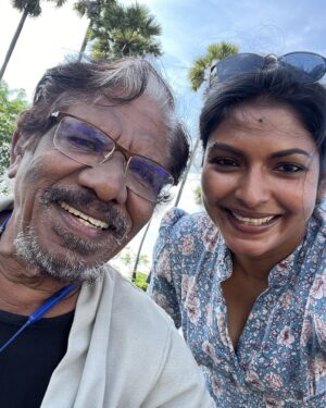 Subathra Robert Instagram - working in the shade of palm trees,with a legend !