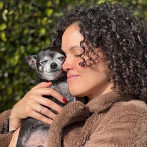 Susie Castillo Instagram - This morning, we said goodbye to our sweet boy, Oscar. He was almost 16 years old and he lived a great life. Traveled more than most people ever get to. The last couple years had their rough moments — his health was failing (congestive heart failure) — but he was a trooper. He always took his medications, even when we could tell he didn’t want to. The vet told us he may live 6-12 more months if everything went well, and this mofo went and  lived 2.5 more years. Like I said, trooper. I always struggled a bit with Oscar because I wanted to smother him with love, but he was nooot into it. He didn’t like too much affection. So it often felt like we had a disconnect. Like our love languages were different. But in the end, I realize that I loved him the way I was meant to love him, and him me. He was a blessing. Despite occasionally being a HUGE pain in the butt (IYKYK). Short version, he liked to yell at us if we didn’t give him what he wanted, and that yelling sound was unlike any sound any dog has ever made. Picture the air in a helium balloon being let out verrrrry slowly lol. It drove me crazy sometimes. And yet right now, going on 11 hours since his passing, I miss it so much it hurts. Oscar, wherever you’re off to, I love you and I miss you, and I hope we meet again ❤️