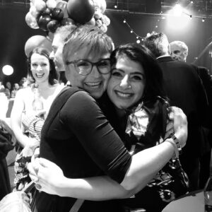 Susie Youssef Instagram - I love Cal Wilson. I was a fan before I was her friend so I felt ridiculously lucky when she became one of my biggest cheerleaders. Her friendship changed me. God, she made me laugh. How could you not smile at that human rainbow. She made me want to be better as a friend and as a comic. She kept my heart safe when I shared my worries with her and I will miss her more than I can say. I haven’t wanted to write this post because it doesn’t matter what I write, it won’t do her justice. I can’t contain the feelings I have for her in a few words. I kept thinking of a Stephen King quote about how the most important things are the hardest to say because words diminish them and we want more than just to say the thing, we want an understanding ear (I’ll post the actual quote) 

And then I realised that there are so many understanding ears because she was universally adored. I have no doubt of her love for her friends and family because she said it and showed it constantly. She loved with every fibre of her beautiful Lincraft-loving heart.

I’m so grateful that I got to hold her masculine hand this week and kiss her head and tell her I loved her. I’m still angry that she’s gone. My heart breaks for Chris and Digby. I don’t know how to finish this except to say that when the anger and heartbreak passes, if it ever does, I have so many memories that will make me laugh and cry and I know how lucky I am for that.