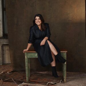 Susie Youssef Instagram - Woman In Black On Table In Boots. It’s a working title. 
Episode 5 of Deadloch is out tomorrow on @primevideoaunz #deadloch 

📸 @brewbevanphoto