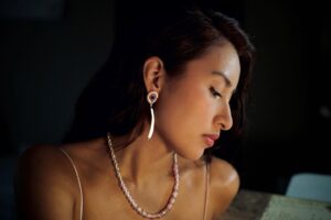 Tania Larsson Instagram - Often times many of us carry a shared love for adornment and art, but how many of us adorn ourselves while we create? We wear jewelry to feel empowered, protected, and sometimes because it inspires us. Other times it just becomes part of who we are and our everyday and we would feel naked without our favorite earrings or necklace on while we work.

This photo is the first of a new series I’m working on where I profile an artist who carries a shared love of adornment, and the values that come with the creative process that forms the foundation of our artistic integrity and livelihood.

Featured here to kick off this series is Wakeah Jhane, a Comanche and Kiowa Ledger artist known for her depictions of Indigenous life, motherhood, birth, family and womanhood. She is wearing caribou tufted vintage beaded studs with a dentalium shell drop along with a vintage Italian pink opal beaded necklace with silver beads and chain that will be available in my coming jewellery release.

I got a chance to visit Wakeah in her home and exchange our love for smoked hide and what it means to uplift community. I had the privilege to step into her studio as she painted her new body of work for the Santa Fe Indian Market this August. She states “I wear jewelry while I work to adorn my body in a way that uplifts my spirit. It helps my soul feel good and provides me with the good energy I need to create and breathe life into my heart work.”

#wakeahjhane #gwichinfinejewellery #indigenousart #vintagebeads #ledgerart #dentalium #swaia2023