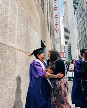 Tania Larsson Instagram - This is my love Razelle Benally graduating from NYU Tisch with her MFA this past month!

I’m extremely proud of her massive accomplishment not only did she survive the pendemic while in graduate school but she also had to work full time in two jobs as a writer on Dark Winds, and a director for the @showtime documentary series Murder in Big Horn while a full time student to be able to graduate.

She was nominated by her faculty with the honour to lead them during the salute ceremony as the banner bearer for the Maurice Kanbar Institute of Film and Television. She was also recognized in the speech of the president of her school during the ceremony and we screamed way too loud in joy when we heard her name out loud!

You can count on your fingers how many Indigenous people have graduated from this prestigious program and I’m so proud of her for honouring her gifts and working so hard for this accomplishment. I would also like to thank the faculty who saw her talents and pushed her to get even better!

Congratulations my love for graduating with the class of 2023 💜💜 #nyutisch #nyuclassof2023