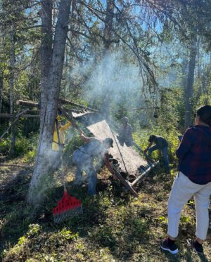 Tania Larsson Instagram - Had a wonderful week at the Mouse Camp outside of Fort Simpson tanning hides.

Qillu fleshed her hide with baby on her back sleeping soundly.
We helped Erin lace a large moosehide on a frame, and let it dry in the sun to be ready for scraping.
Ikajuut enjoying the shade in the bug tent.
Ethel’s hide all softened laced up on a frame blessed by a dragonfly.
Cathy scraping the water out of her hide so she can twist it.
Baby Ikajuut sleeping in his swing while Qillulaaq and Celine scrape her moosehide hide.
Earl monitoring camp after a bear stopped by to check it out.
Enjoying the sunset after a long hot day working on hides.

#moosehidetanning #denenahjo #liidliikuefirstnations