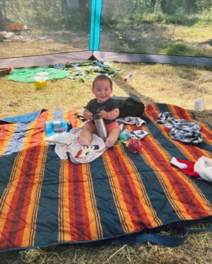 Tania Larsson Instagram - Had a wonderful week at the Mouse Camp outside of Fort Simpson tanning hides.

Qillu fleshed her hide with baby on her back sleeping soundly.
We helped Erin lace a large moosehide on a frame, and let it dry in the sun to be ready for scraping.
Ikajuut enjoying the shade in the bug tent.
Ethel’s hide all softened laced up on a frame blessed by a dragonfly.
Cathy scraping the water out of her hide so she can twist it.
Baby Ikajuut sleeping in his swing while Qillulaaq and Celine scrape her moosehide hide.
Earl monitoring camp after a bear stopped by to check it out.
Enjoying the sunset after a long hot day working on hides.

#moosehidetanning #denenahjo #liidliikuefirstnations