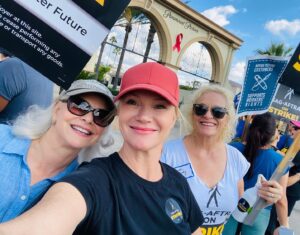 Tara Buck Instagram - Day #103 - Time to rally the neighborhood!  Grateful the AMPTP is back at the bargaining table today with our @sagaftra negotiating team.  We are hopeful for a fair counter offer that honors the dignity of our profession and the hard work of so many individuals who bring the magic to entertainment. We all just want to get back to the work we love after all.  In the meantime, one day longer, one day stronger.  We are a united front!#sagaftrastrong #sagaftrastrike #power2performers