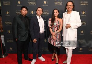 Tazbah Chavez Instagram - I first met @sterlinharjo and @taikawaititi about sixteen years ago when I was interning for @birdrunningh2o at Sundance — years after first meeting him when I was 16 on a film panel for my first short film. Through Bird, Sterlin and Taika instantly became my brothers/sisters and over the years they have been two people who called me what I was before long before I would call myself it: a writer, a poet, an artist, a filmmaker — then they invited me to make @rezdogsfx with them and it’s been the most rez boujiest time of my life alongside our fellow writers, producers, cast and crew. To be honored by @peabodyawards alongside them, presented by badass @kali_ko_reis , is pretty unreal — and a testament to their own perseverance and commitment to bringing others up with ‘em. And selfishly, anytime spent with @paulinaalexisofficial @lanefactor and @bobbydues is simply… blessings! 🪶 🐕 love love love [dress: @byellowtail . m/u: @paintedbypetra . shoes: @happy_brain lemme borrow them . jewels: 6th gen family heirlooms . hair: aveda taught me]