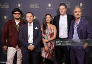 Tazbah Chavez Instagram - I first met @sterlinharjo and @taikawaititi about sixteen years ago when I was interning for @birdrunningh2o at Sundance — years after first meeting him when I was 16 on a film panel for my first short film. Through Bird, Sterlin and Taika instantly became my brothers/sisters and over the years they have been two people who called me what I was before long before I would call myself it: a writer, a poet, an artist, a filmmaker — then they invited me to make @rezdogsfx with them and it’s been the most rez boujiest time of my life alongside our fellow writers, producers, cast and crew. To be honored by @peabodyawards alongside them, presented by badass @kali_ko_reis , is pretty unreal — and a testament to their own perseverance and commitment to bringing others up with ‘em. And selfishly, anytime spent with @paulinaalexisofficial @lanefactor and @bobbydues is simply… blessings! 🪶 🐕 love love love [dress: @byellowtail . m/u: @paintedbypetra . shoes: @happy_brain lemme borrow them . jewels: 6th gen family heirlooms . hair: aveda taught me]
