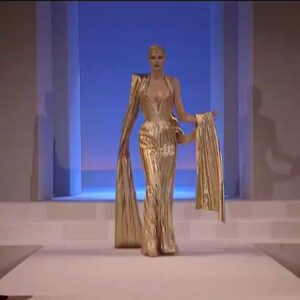 Thierry Mugler Instagram - 🔊✨👄✨ Wishing for all a golden 2021 !! ❤️ Mesmerizing Radana back in 1999 !  #Muglerarchives  #mugler #thierrymugler #manfredthierrymugler #goldendress #lingerie #fetishes #corset #muglerized ©Thierry Mugler⠀
 Manager : @jbrougeot #jbrougeot