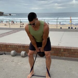 Tim Robards Instagram - Bondi’s outdoor gym is definitely one of my favorite outdoor places to train. It’s a huge bonus that the regulars have left various equipment for people to use, including an assault bike 😙👌🏼 It was great to join forces with the absolute specimen @mrtimrobards for some movement, sun, and grub. Our session 👇🏼
1️⃣ Warm-up 10min
2️⃣A. Muscle Up 5x3 
2️⃣B. Banded KB Swing 5x8
3️⃣A. Australian Pull Ups 4x2RIR
3️⃣B. P-Bar Dip & L-Sit 4x2RIR
4️⃣ Overhead Tricep Extension - Cluster Set - 3x2RIR 1xAMRAP (15sec rest)
5️⃣ KB/Banded Hammer Earthquake Curls - Cluster Set - 3x2RIR 1xAMRAP (15sec rest)
🧡 Happy Training 💪🏼
