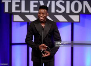 Toheeb Jimoh Instagram - Last night I recieved my first acting award at the @criticschoice Celebration of Black Cinema and Television event 🖤💫 I couldn't have asked to be introduced by anybody better than @mrbrettgoldstein (his speech nearly made me cry but I firmed it) - It was such a special night for all of my family (Mum, Dad, Brother and Grandma😂) here's to many more!! 🙌🏿🙌🏿

Look 👔   jewellery 💎: @newbottega
Styled by 💫: @ysmnsabri and @romel.doyle
Make up 💅🏿: @chousner
Hair ✂️: @theshaveplace

#TedLasso #criticschoiceawards #samobisanya #toheebjimoh