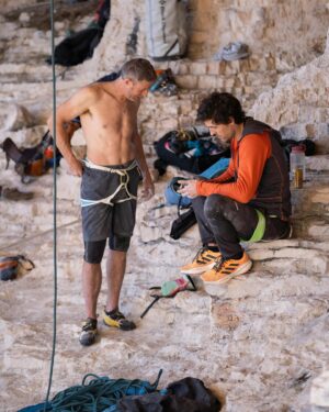 Tommy Caldwell Instagram - This summer while in the bugaboos. @sonnietrotter @alexhonnold and myself started a gentlemen’s race to 9a.  At the time I hadn’t fully realized the last time I focused on sport climbing was over 20 years ago!

Some things have changed. I haven’t found it as crowded as I thought, but the sport crags (which are all outside of Wilderness) do feel much more industrial. Grid bolted cliffs,  fixed draws, and a lot more chalk. Some modern crags feel less like climbing rocks and more like rocks are being made into climbs. The tatics I discovered in my teens now seem common.  Knee pads are worn on just about everything and you often meet people at the crag that have been projecting the same climb for 20 or more days. 

And  now there is a whole new set of tatics. Spray bottles to combat the dry fire, heated rocks in the chalk bag on cold days. Or even dry ice on the hot days. Fans, hangboards at the crag, trainers, nutrition strategies. Most high end climbers take months off touching real rock to focus on strength building. 

 I feel mixed about some of these evolutions but I am trying not to be a luddite. Overall it’s still a game I love.  For me, Progress doesn’t seem to materialize the way it did in my 20’s.  But it’s fun to feel motivation and drama of progress. Sport climbing sure is a head game. There is something cool about the lengths climbers go to to find progress towards an activity that  has little intrinsic value. Maybe that’s the point. The value  lies in the lifestyle it creates. Long days outside, with friends, in beautiful places obsessing about something that ultimately brings friendship, laughter,  health and fitness. 

Thanks Alex and Sonnie for helping me rediscover something  I had mostly forgotten.  Time will tell if some busy, middle aged dads can  reignite the power of their youth, but this race has brought some extra focus and joy to my winter and I am grateful.
📸 @james_lucas @lasportivagram @team_edelrid @corosglobal