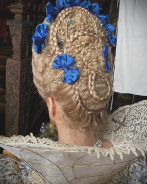 Trine Dyrholm Instagram - Mary & George - Queen Anne of Denmark 
Swipe for close ups and behind the scenes..

These are some variations of my favourite hairstyle for @trinedyrholmofficial as the Queen. Possible one of the hardest wig stylings I’ve ever had to do… The whole look was created with just the wig hair (only additional is the trellis trim) and a lot of hope… When our amazing Hair and Make Up Designer @paulgoochmakeupandhair suggested this for a style, I was terrified and excited. How to create tiny waves, in semi circles that all match up? Up a frame?!!! It took a lot of concentration, patience, a small Marcel tong and zero interruptions! (Before anyone zooms in, wig lace at sides was purposely left unglued to allow for Trine’s expressive broad smiles… 😃) 

Gorgeous make up by @inezella_makeup 

Trine was an absolute dream to work with. Thank you so much for your patience, care and professionalism. And the laughs!!!

Huge thank you to Paul Gooch for asking me to be your Key Hair within your fabulous team on this wonderfully epic project ❤️❤️❤️

Stunning costumes by @annieruthsymons 

And thank you Director @oliver_hermanus  for appreciating the backs of hairstyles and including them in shot! 🥰

@herapictureslondon @skytv @maryandgeorgenews #skytv #maryandgeorge #keyhair #periodhair #periodhairstyling #hairstylist #wigstylist #jacobeanhairstyle