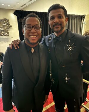 Utkarsh Ambudkar Instagram - 77th annual @thetonyawards aka Date Night with @hibiskisss 

the absolute BEST show on earth. Huge hug to @juleshough for letting me co-host with you. 

thanks @plutotv @cbstv 

styled by: @johntanstyling 
grooming: @chelseagehr 🤎🤎
HairCut: @matthewstylist 

super dope red carpet tuxedo by @_demo_official by DEREK CHAN
Shirt by @prada 
Bow-tie by @titleofwork 
Fancy a$$ Ring and watch by @officialfaberge 
Boots by @carlossantosshoes 

Act ONE look: 
shiny shoulder tux by @philippplein 
Shirt by @hugo_official 
Bow-tie by @titleofwork 
Ring and watch once again @officialfaberge 
Loafers —- stylist’s archives 

broadway is the best place on earth.