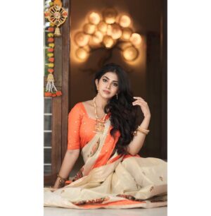 Varsha Viswanath Instagram - Happy Vishu 🧡

📸- @_prasanth_sivadas_ 
Hair - @makeup_by_sabana_ 

.
.
.
.
.
#happyvishu