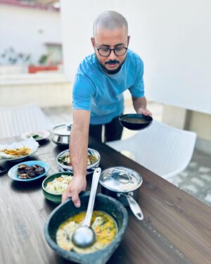 Varun Grover Instagram - Got super busy right after this day (as my standup solo India tour ended and @allindiarankmovie promotions began) but this day in Kolkata was the most joy-filled core memory of recent times. Spent a day in awe of the love for food and stories (and stories told through food) cooked by @bongeats (Insiya and Saptarshi). @sreemoyee.singh joined us for the relaxed, wholesome winter lunch - and WHAT A LUNCH it was! 

1. Insiyar Sansar. 

2. Aamudi fish bhaaja being finished by Saptarshi while Insiya tempers the silent-rockstar of the meal, Masur Daal. 

3. The table being laid. Narkel Bora, Pepe Shukto (Shukto made with Raw Papaya) Aamudi bhaaja, Pabda’r Tel Jhol, and inside the box - the most royal Chitol Machher Muitha. 

4. A closer look at Pabda’r Tel Jhol, with the most delicate-crunchy boris on top. Teasing from the corner in the back, the palette cleanser Imli Chutney/Jhol. 

5. Saptarshi brings in the daal. 

6. Bong Eats before they eat. 

7. The assorted mishti spread from assorted legendary shops around. 

8. We also realised that Insiya and I share our birth date (26th January) and just by chance, Sreemoyee had brought a freshly baked, very unique Pear cake. So of course we cut it on this day, 27th January. 

9. Filmmaker and singer @sreemoyee.singh, Insiya, Saptarshi, and I with - happy food-coma glow binding us together. 

27th January 2024.

(All pics by me except the cake-cutting one clicked by @sreemoyee.singh.)