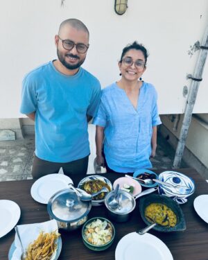 Varun Grover Instagram - Got super busy right after this day (as my standup solo India tour ended and @allindiarankmovie promotions began) but this day in Kolkata was the most joy-filled core memory of recent times. Spent a day in awe of the love for food and stories (and stories told through food) cooked by @bongeats (Insiya and Saptarshi). @sreemoyee.singh joined us for the relaxed, wholesome winter lunch - and WHAT A LUNCH it was! 

1. Insiyar Sansar. 

2. Aamudi fish bhaaja being finished by Saptarshi while Insiya tempers the silent-rockstar of the meal, Masur Daal. 

3. The table being laid. Narkel Bora, Pepe Shukto (Shukto made with Raw Papaya) Aamudi bhaaja, Pabda’r Tel Jhol, and inside the box - the most royal Chitol Machher Muitha. 

4. A closer look at Pabda’r Tel Jhol, with the most delicate-crunchy boris on top. Teasing from the corner in the back, the palette cleanser Imli Chutney/Jhol. 

5. Saptarshi brings in the daal. 

6. Bong Eats before they eat. 

7. The assorted mishti spread from assorted legendary shops around. 

8. We also realised that Insiya and I share our birth date (26th January) and just by chance, Sreemoyee had brought a freshly baked, very unique Pear cake. So of course we cut it on this day, 27th January. 

9. Filmmaker and singer @sreemoyee.singh, Insiya, Saptarshi, and I with - happy food-coma glow binding us together. 

27th January 2024.

(All pics by me except the cake-cutting one clicked by @sreemoyee.singh.)